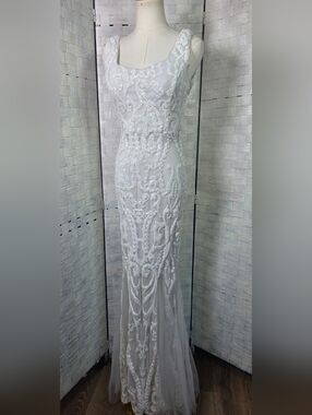 Elegant White Beaded Sleeveless Evening Gown